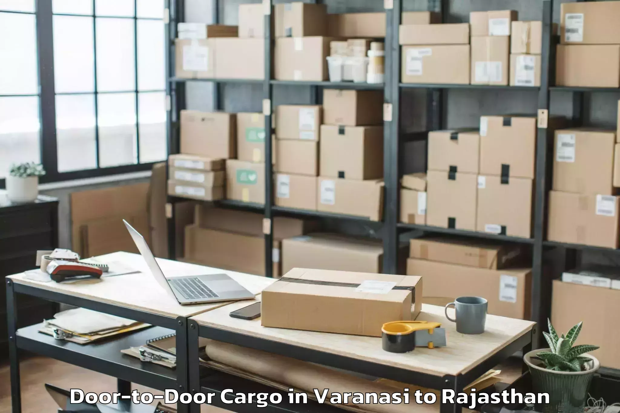 Book Varanasi to Raffles University Neemrana Door To Door Cargo Online